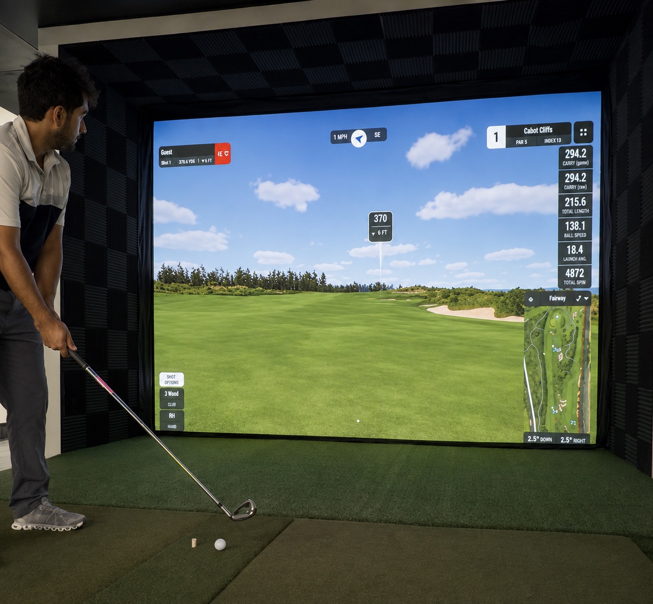 Golfer using the Dev's Golf Sim indoor simulator bay in Essex, Ontario